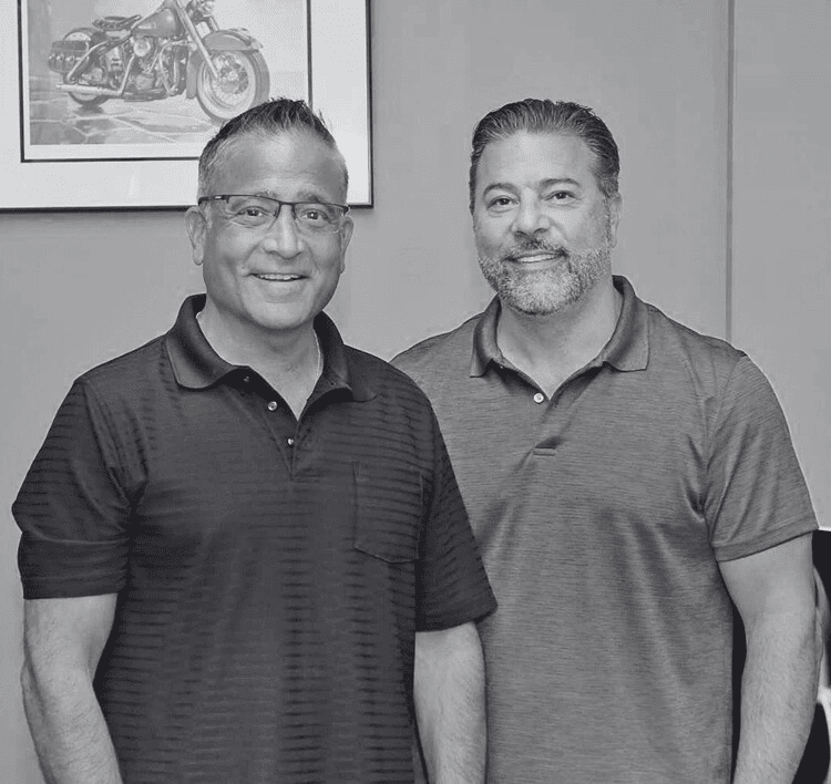 Business professionals smiling at Hozio headquarters for innovative workspace solutions.