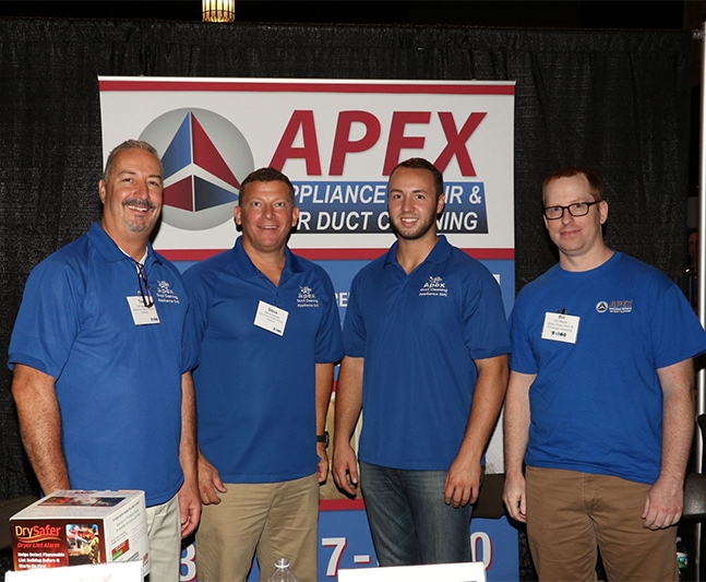 Certified HVAC professionals representing Hozio at an industry event.