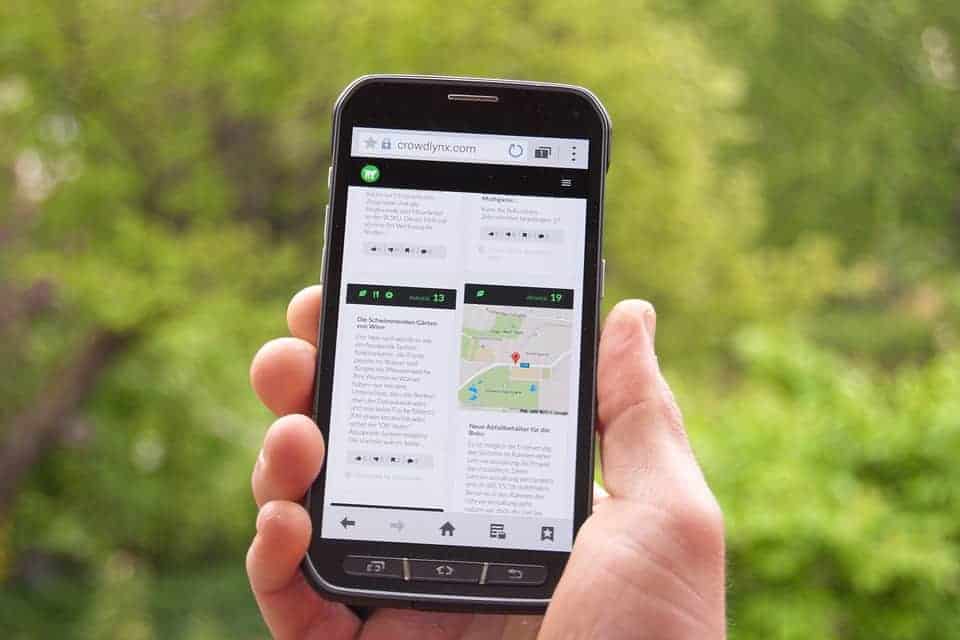 Crowdlynx mobile app on smartphone for real-time tracking and analytics of outdoor spaces.
